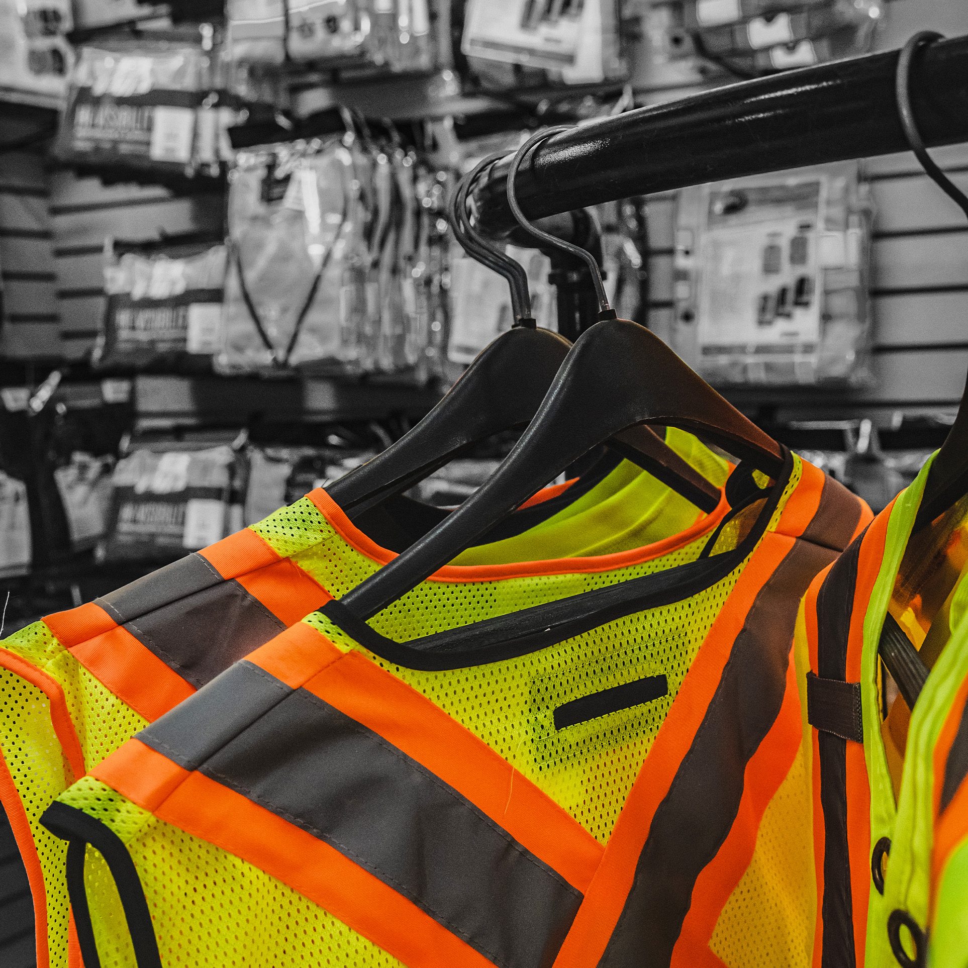 Hi-vis safety vests on hangers in the Tool Shed store